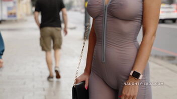 Public demonstrating MILF in semitransparent jumpsuit gets some attention
